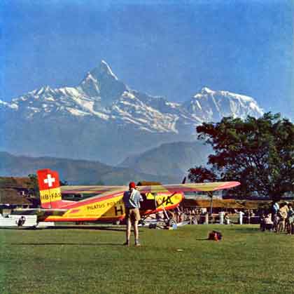 
Pilatus-Porter airplane used to carry climbers, Sherpas, and supplies from Pokhara to the Dambush Pass at 5200m, with Machupuchare in background - The Ascent Of Dhaulagiri book
